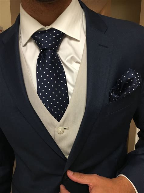 blue vest white suit.